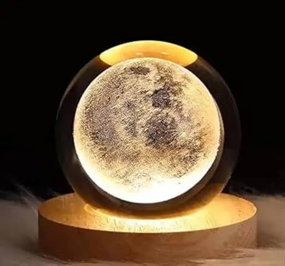 Moon lamp with a wooden base on a dark background