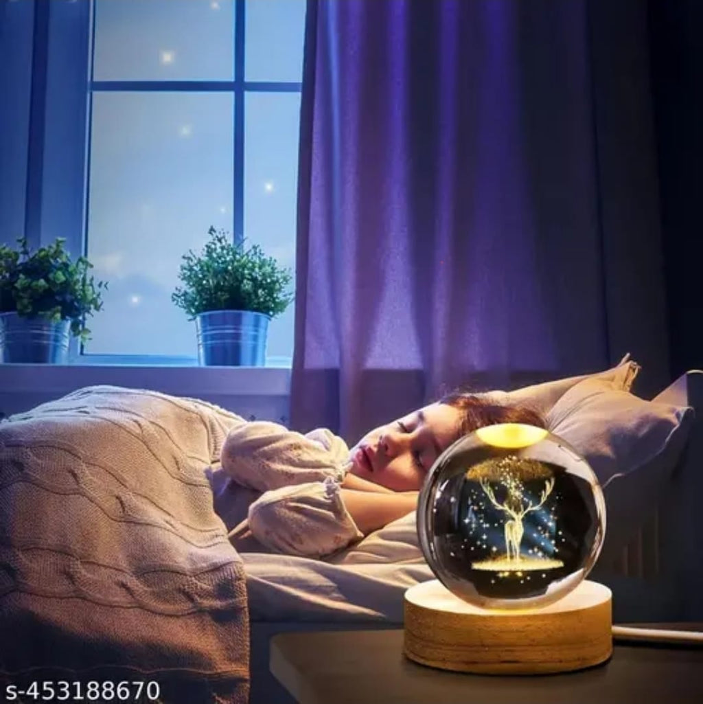 Person lying in bed with a glowing crystal ball on a wooden stand next to the bed.
