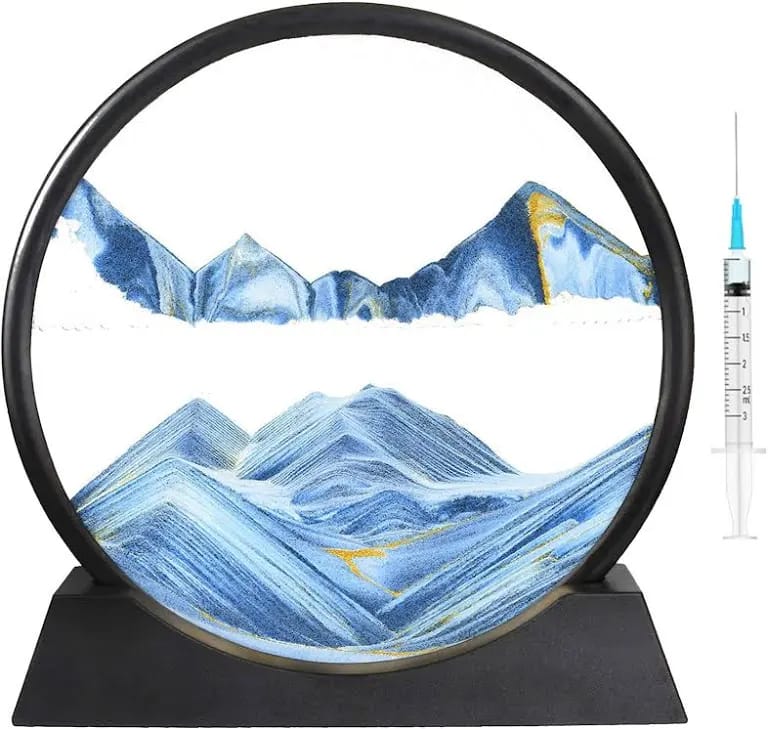 Decorative mountain scene in a circular frame with a syringe on a white background