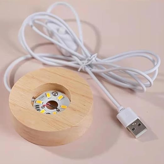 Wooden LED light bulb with USB cable on a beige background